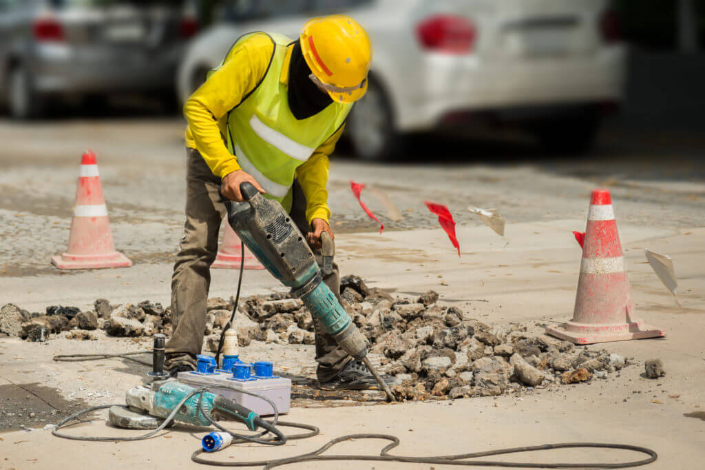 construction worker using jackhammer