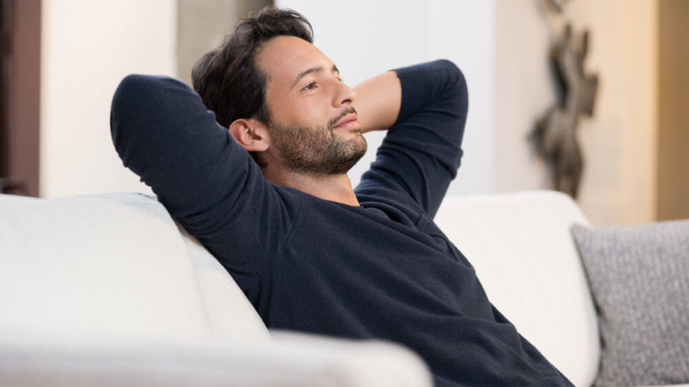 Man resting on couch