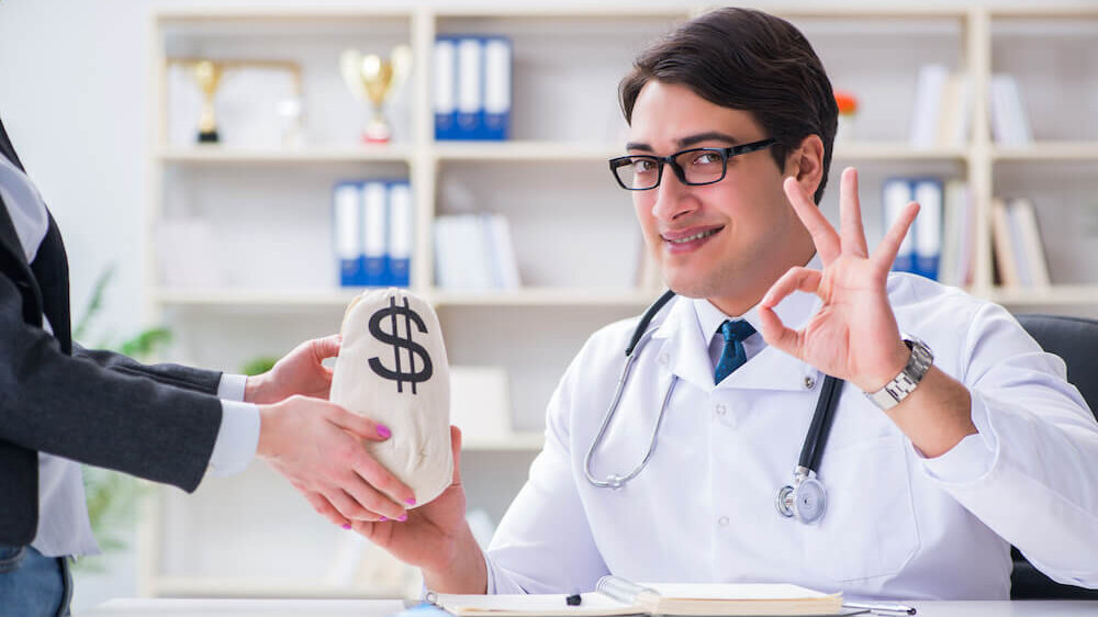 Doctor taking money