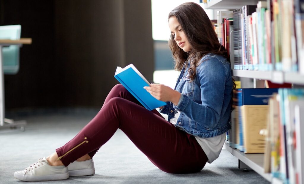 Teenager reading a book